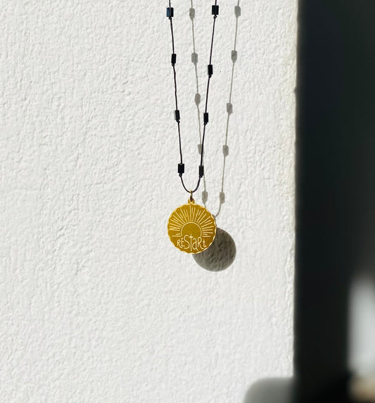 Restart | silver coin pendant